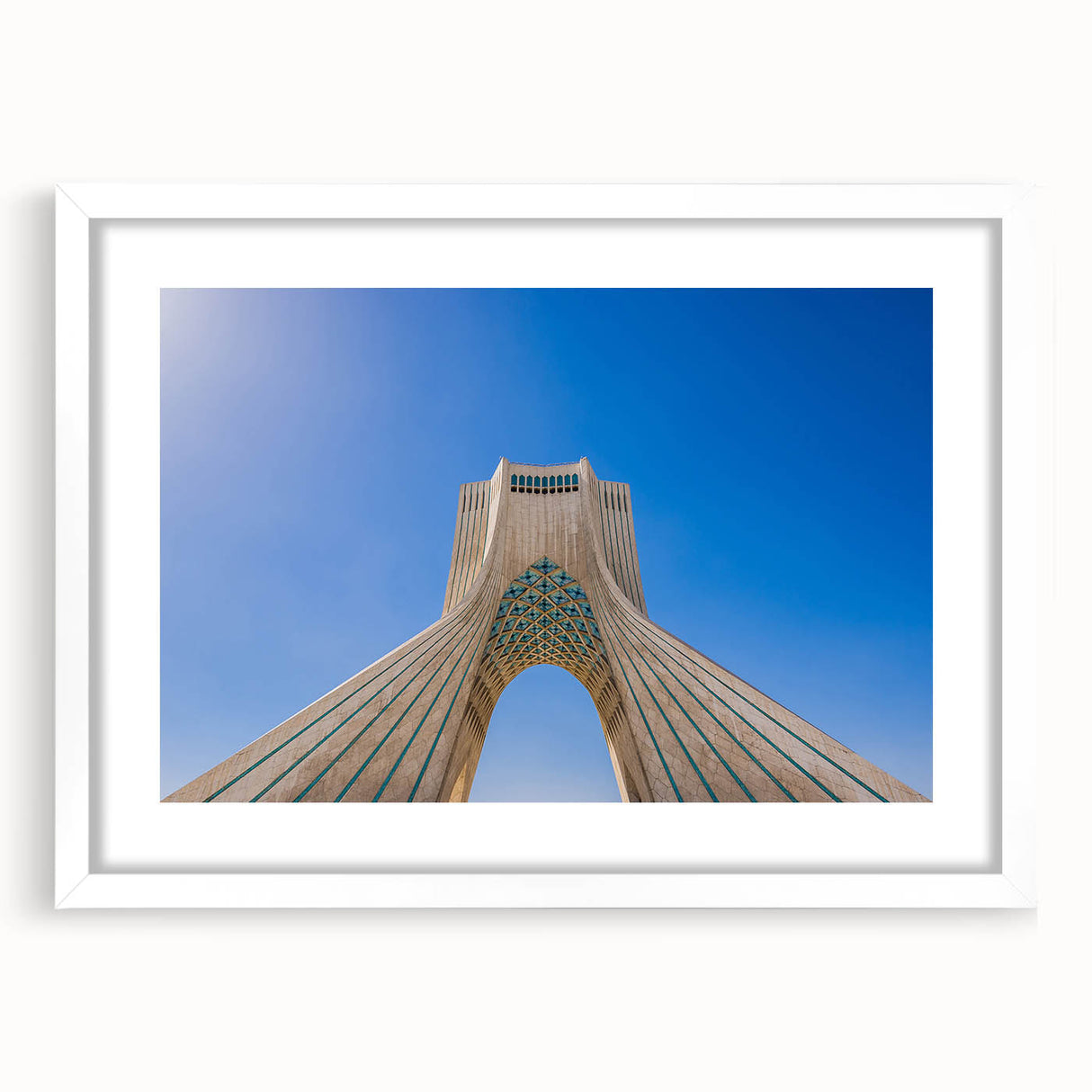 Abstract art print of a Middle Eastern landscape in earth tones on a white framed mat, ideal for dining room decor.