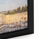 Black framed canvas of Jerusalem skyline with textured, colorful art, ideal for living room decor.