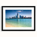 Colorful abstract art print of a textured Abu Dhabi skyline in vibrant hues, framed with a black mat.
