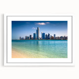 Abstract art print depicting the Abu Dhabi skyline in muted gray and blue tones, framed with a white mat.