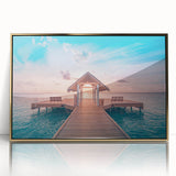 Large art print of Bora Bora scenery in muted blue and green tones, framed in gold acrylic.