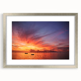 Textured art print of abstract ocean waves in shades of blue and green on a silver-framed canvas, suitable for bedroom decor.