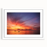 Abstract art print of a Tahitian coastline in muted blue and green tones on a framed white mat, ideal for dining room decor.