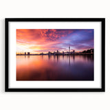 Abstract art print of Auckland's skyline in vibrant, colorful hues on a large textured canvas, ideal for living room decor.