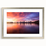 Textured art depicting an abstract Auckland skyline in muted gray and blue tones, framed in silver.