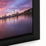 Extra large framed canvas of Auckland skyline in black with colorful, textured highlights, ideal for living room decor.