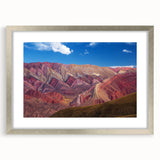 Textured abstract art print depicting a stylized scene in cool blue and gray tones, framed in silver, ideal for bedroom art.