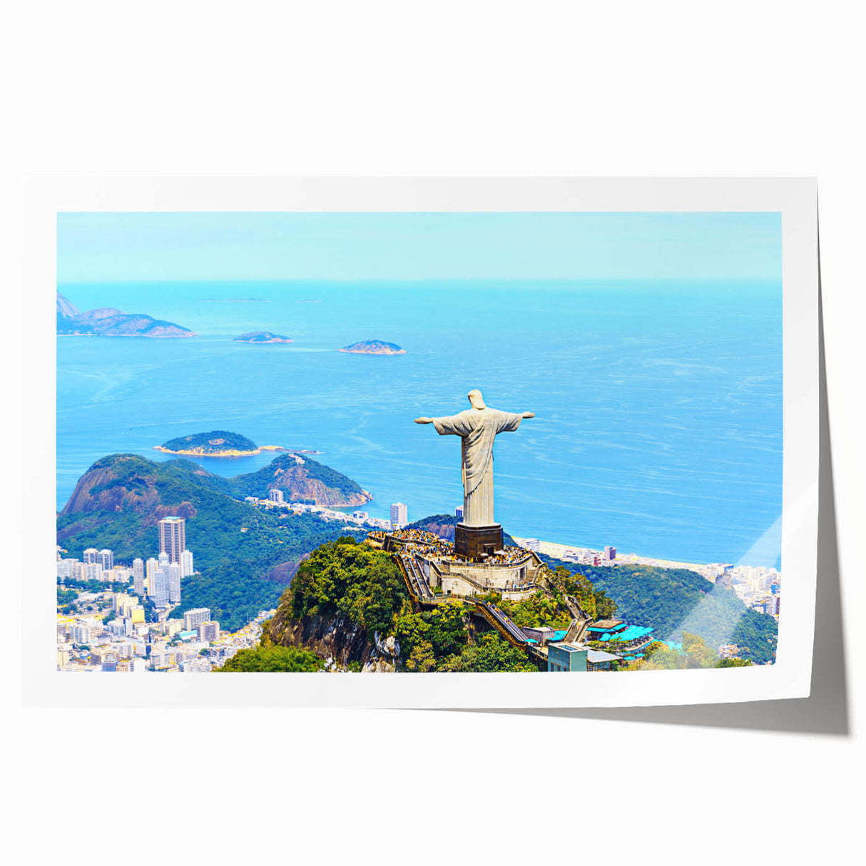 Rolled print of a Brazilian landscape featuring vibrant green foliage and a distant mountain range.