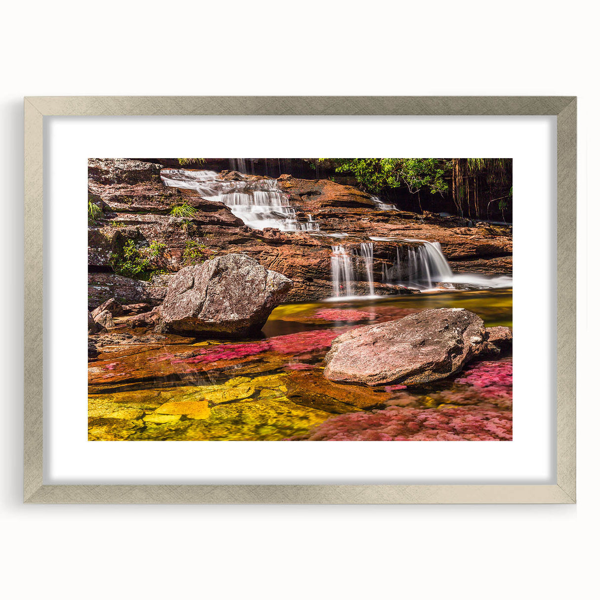Textured abstract art print depicting a vibrant Colombian landscape in a silver frame, ideal for bedroom art.