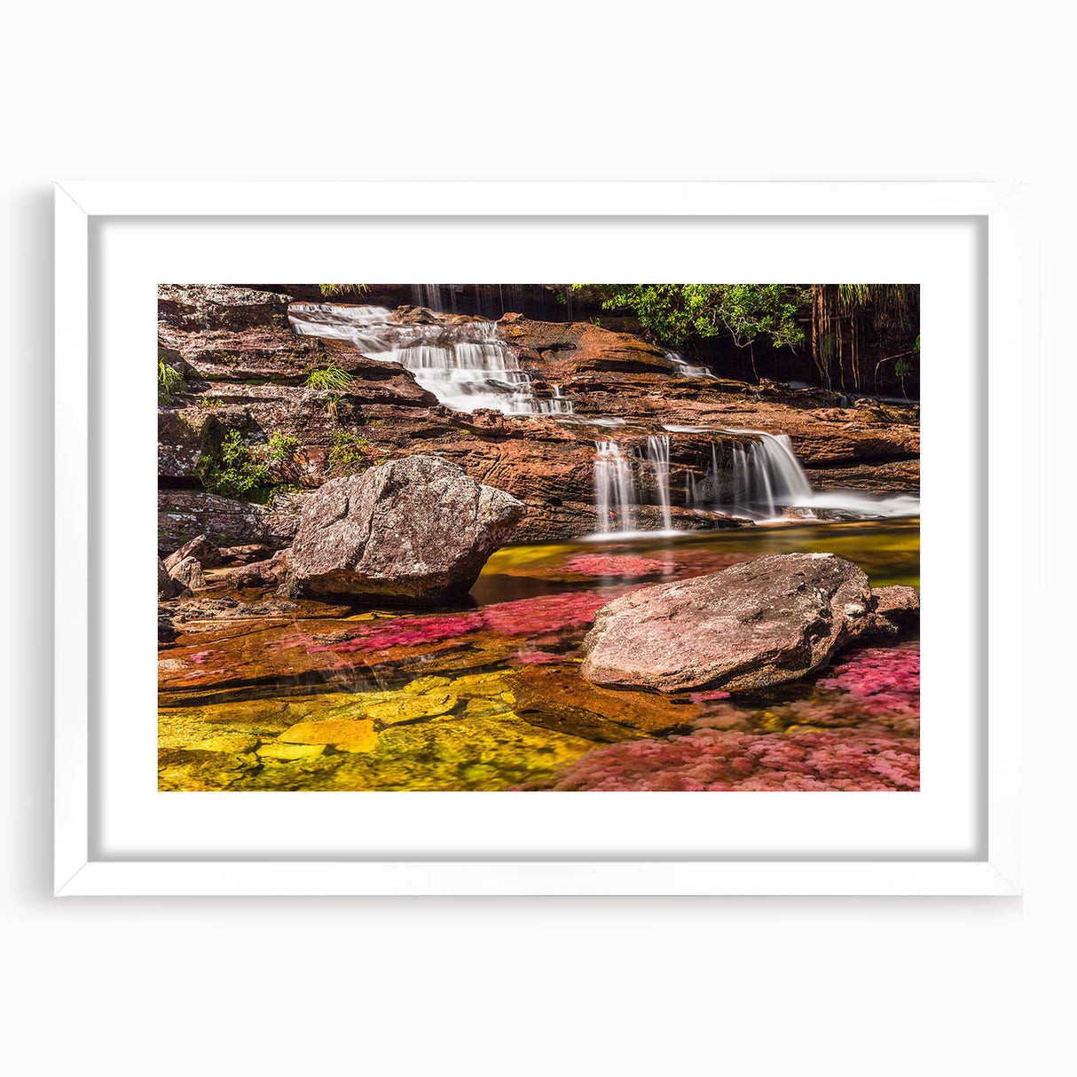 Abstract art print depicting a vibrant, colorful Colombian landscape on a white-framed canvas.