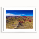 Abstract art print of a Peruvian landscape in muted earth tones, framed with a white mat, suitable for dining room decor.