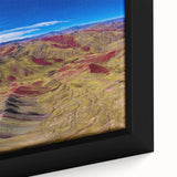 Textured black wall art of a South American scenery on extra large framed canvas, featuring colorful elements.