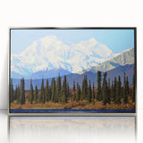 Mid-century modernist art depicting Alaska scenery in muted earth tones on a silver-framed acrylic print.