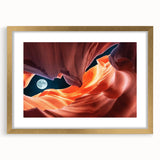 Extra large abstract art print of Antelope Canyon in Arizona, featuring textured red and orange hues, framed in gold.