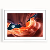 Abstract art print of Antelope Canyon in Arizona, featuring swirling orange and red rock formations, framed in white.
