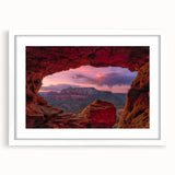 Abstract art print of Sedona landscape in muted earth tones on a white framed mat, suitable for bedroom or dining room decor.