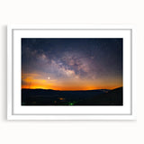 Abstract art print of Arkansas scenery in muted earth tones, framed with a white mat, suitable for dining room decor.