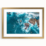 Extra large abstract art print of California's Big Sur in a gold frame, featuring textured blue and gray tones.