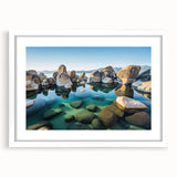 Abstract art print of Lake Tahoe in muted blue and green tones on a framed white canvas, ideal for dining room decor.