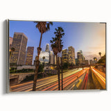 Framed canvas of Los Angeles landscape with vintage poster art style, featuring a black and colorful palette.