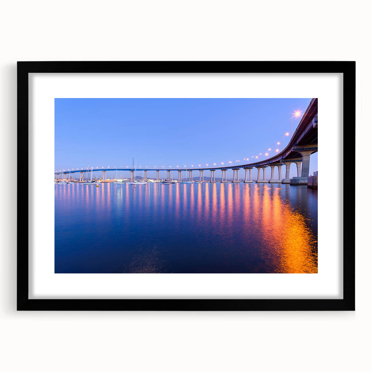 Colorful abstract art print of San Diego scenery in black frame, ideal for living room decor.