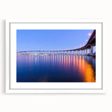 Abstract art print of San Diego skyline in muted blue tones on a white framed canvas, ideal for dining room decor.