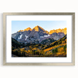 Textured art print of abstract Rocky Mountains in muted earth tones on a framed canvas, suitable for bedroom decor.
