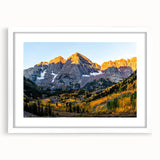 Abstract art print of Rocky Mountains in muted earth tones on a white-matted frame, ideal for dining room decor.