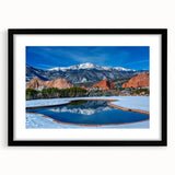 Colorful abstract art print of Colorado Springs, with vibrant textures on a large black-framed canvas.