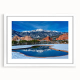 Abstract art print of Colorado Springs with muted earth tones on a framed white mat, suitable for dining room decor.