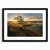 Abstract art print featuring textured, colorful swirls on a large canvas, framed in black, ideal for living room decor.