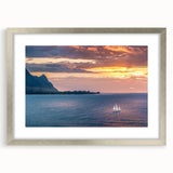 Textured abstract art print of Kauai landscape in muted green and blue tones, silver-framed with mat.