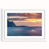 Abstract art print of Kauai, Hawaii landscape in muted green and blue tones on a framed white mat.