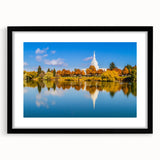 Abstract art print of vibrant Idaho scenery on textured canvas, framed in black, suitable for large living room walls.