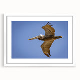 Abstract art print of Louisiana scenery in muted green and blue tones, framed with a white mat.