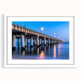 Abstract art print of Chesapeake Bay in muted blue and green tones on a white framed canvas, suitable for dining room decor.