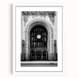 Abstract art print of Detroit skyline in muted gray and blue tones on a framed white mat, ideal for dining room decor.