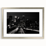 Textured abstract art print of Minneapolis skyline in muted blues and grays on framed silver mat, suitable for bedroom decor.
