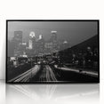 Large abstract wall art depicting the Minneapolis skyline in muted gray and blue tones on a framed acrylic.