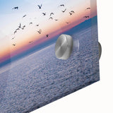 Large abstract wall art featuring fluid shapes in muted earth tones on acrylic glass, ideal for dining room ambiance.