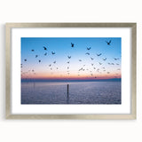 Textured art of abstract Mississippi scenery in muted earth tones on a framed silver mat, suitable for bedroom decor.