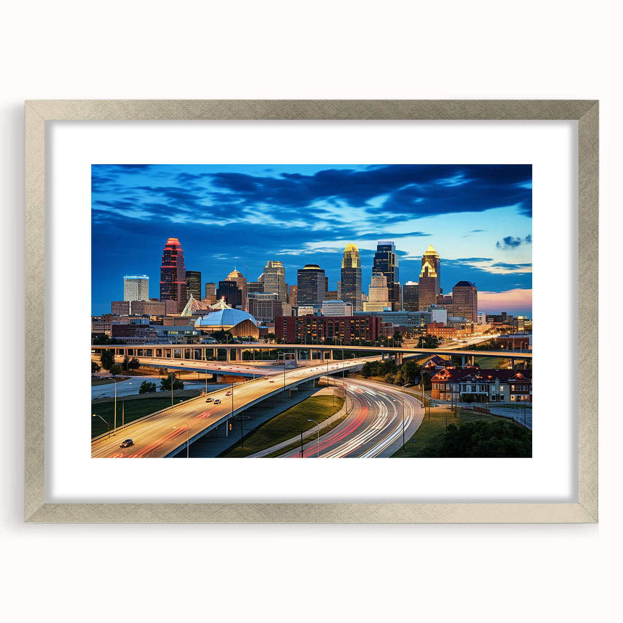 Textured abstract art print of Kansas City skyline in muted gray and blue tones, framed with a silver mat.