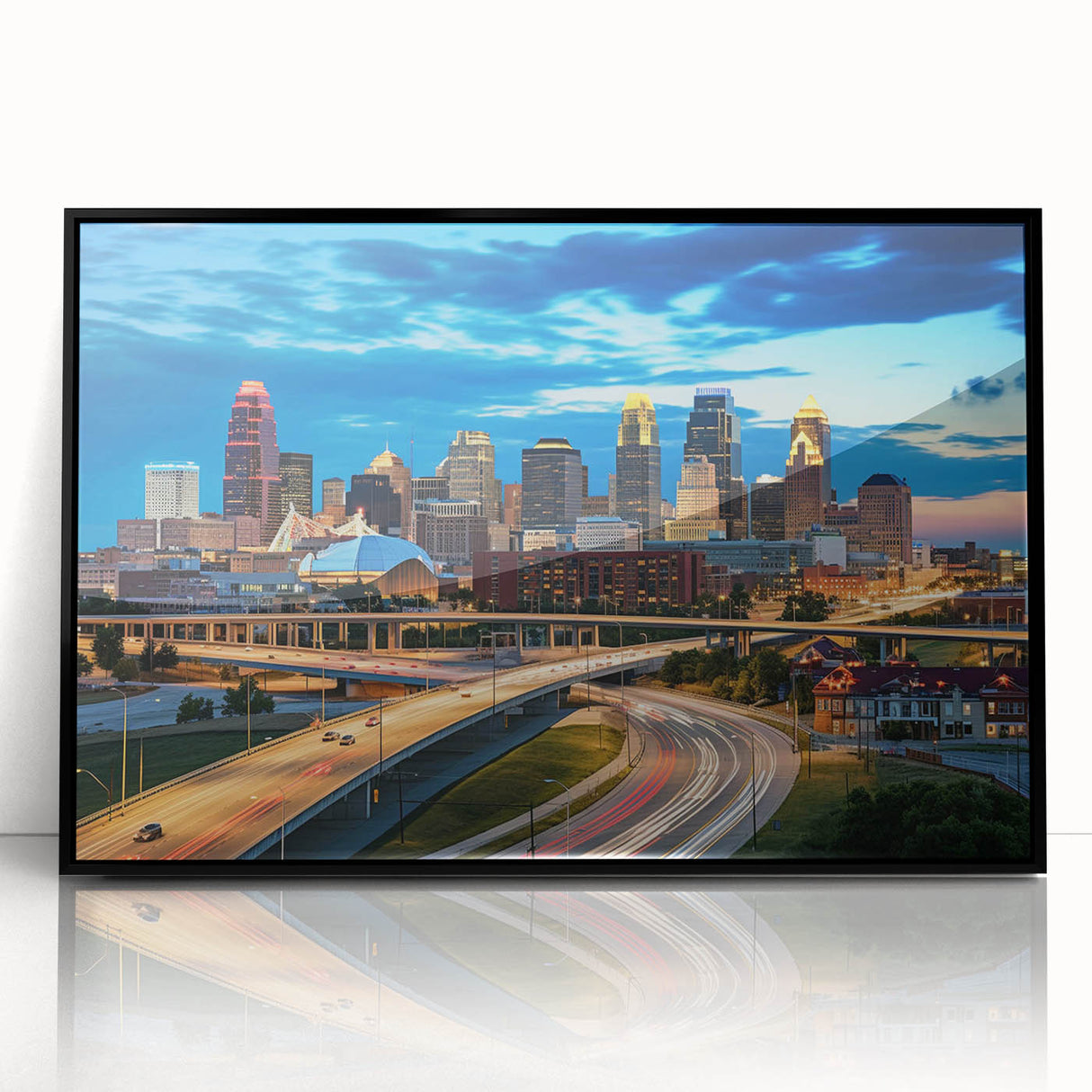 Large abstract wall art of Kansas City skyline in muted gray and blue tones on framed acrylic.