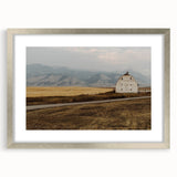 Textured abstract art print of Montana scenery in muted colors, framed in silver, ideal for bedroom decor.