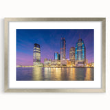 Textured abstract art print depicting a muted color landscape, framed in silver, suitable for bedroom decor.