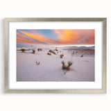 Textured art depicting abstract New Mexico scenery in muted earth tones on a framed silver mat, suitable for bedroom decor.