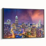 Black and white framed canvas of Charlotte, North Carolina skyline in vintage poster style, suitable for bedroom decor.