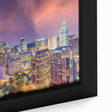 Textured black wall art of Charlotte skyline with colorful accents on a large framed canvas, ideal for living room decor.