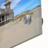 Mid-century modernist style abstract depiction of the Outer Banks in muted blue and green tones on acrylic glass.