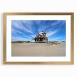 Extra large abstract art print of the Outer Banks, featuring textured waves in muted blues and grays on a framed canvas.